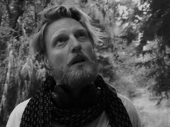 Black and white portrait of Ryan Board artist on location filming in Tomar, Portugal, 2023